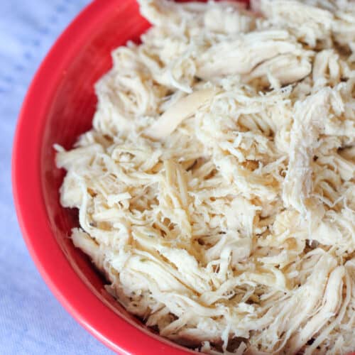 Slow Cooker Shredded Chicken in red bowl