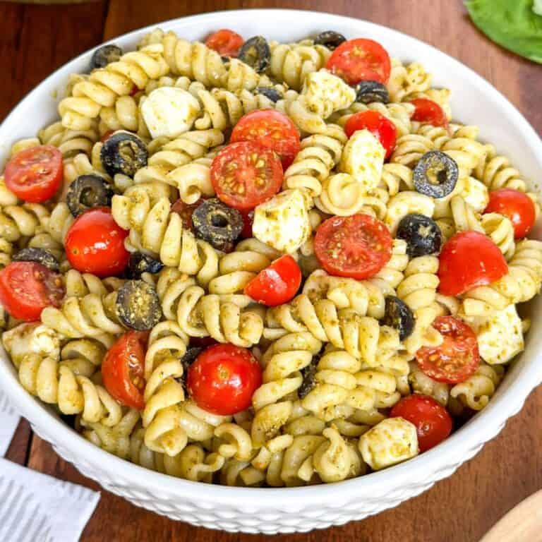 A bowl of Easy Pesto Pasta Salad on a table.