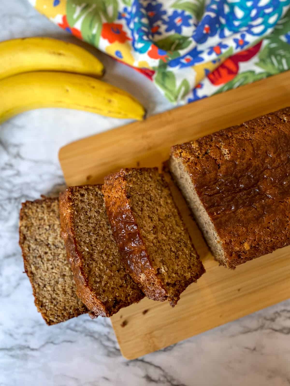 Slices of banana bread on a cutting board.