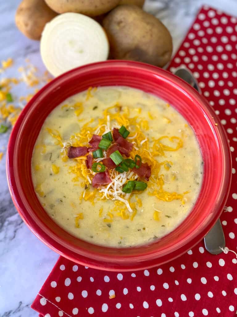 Loaded Baked Potato Soup in a red bowl