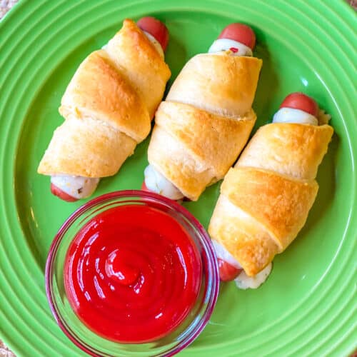 green plate of Pepper Jack Cheese Crescent Pigs in a Blanket