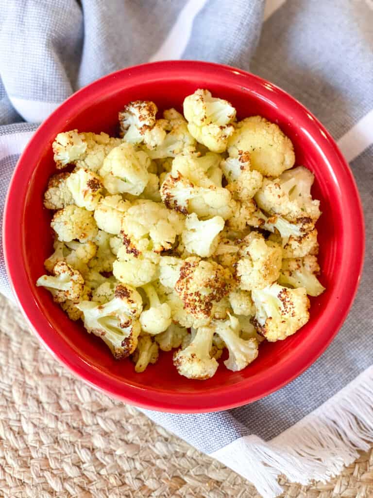 red bowl filled with Air Fryer Cauliflower