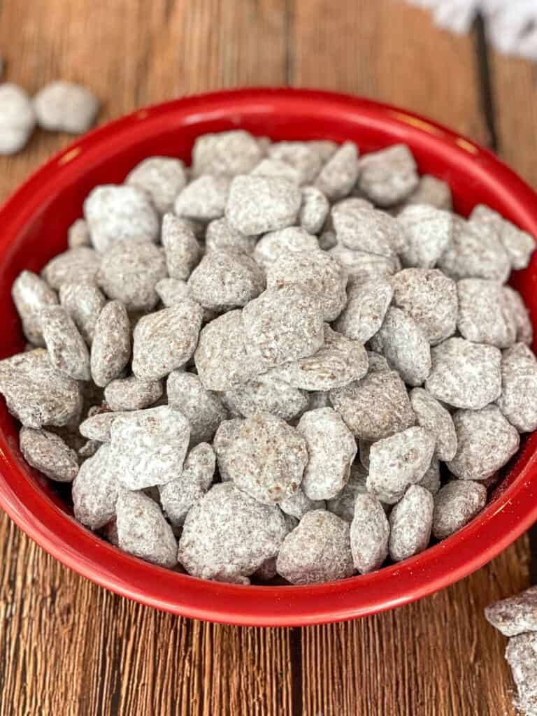 close up of puppy chow cereal snack in a red bowl