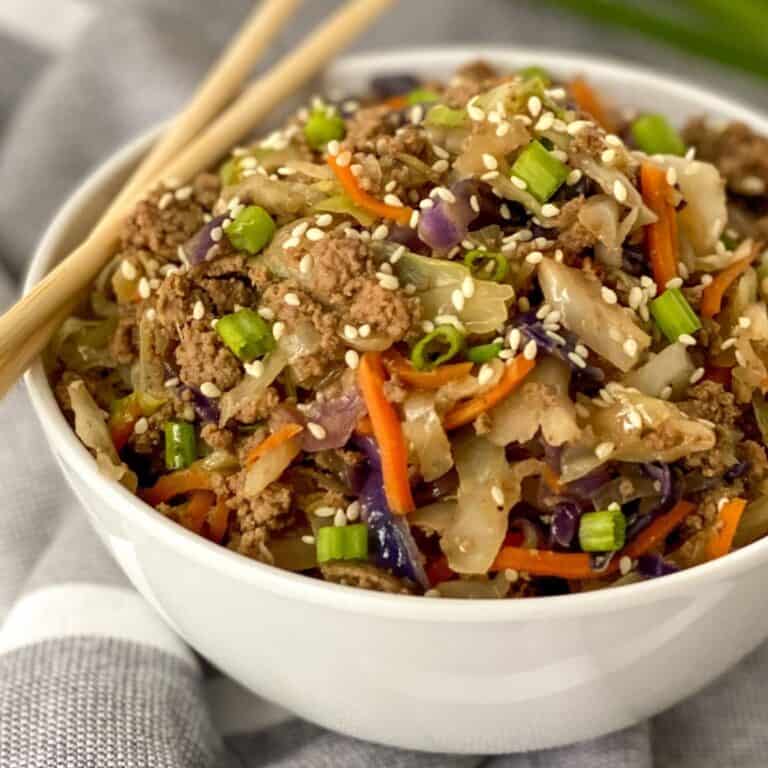 one pan egg roll in a bowl with chopsticks on the side