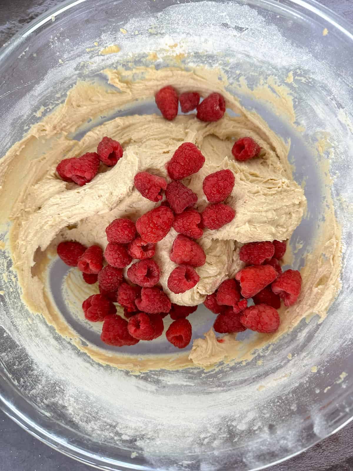 adding the raspberries to the batter