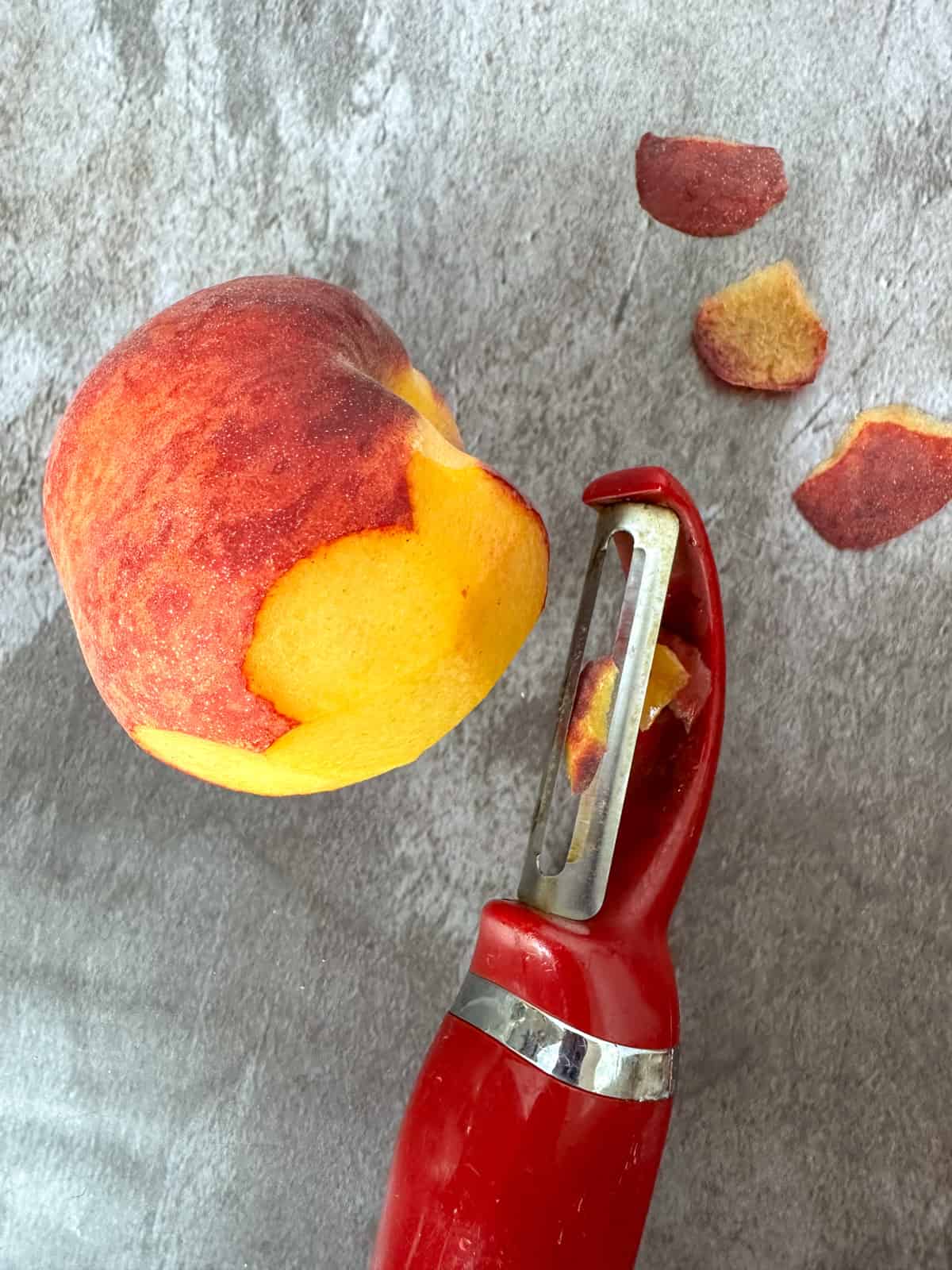peeling peaches with a peeler