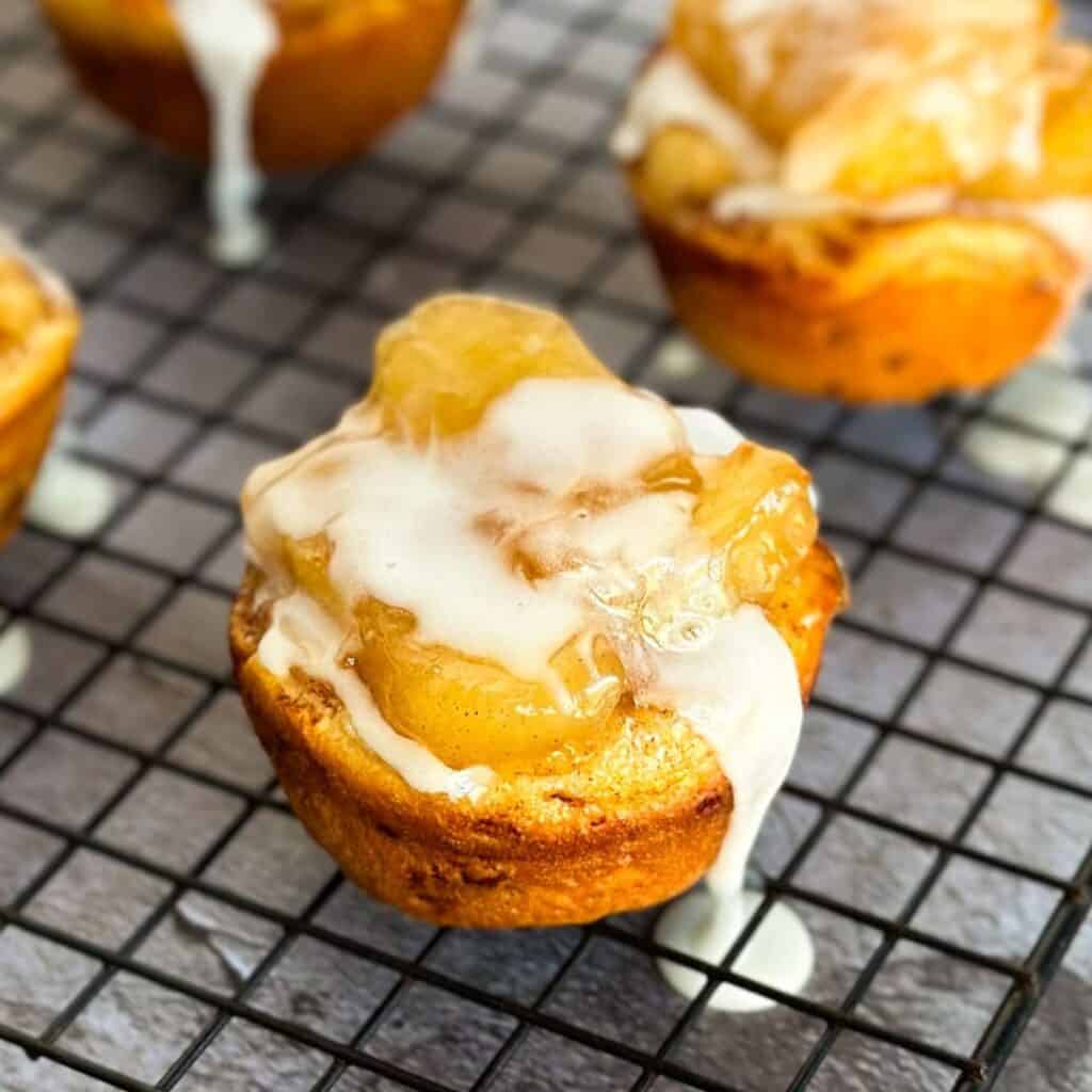 2 ingredient cinnamon apple pie cups on a wire cooling rack