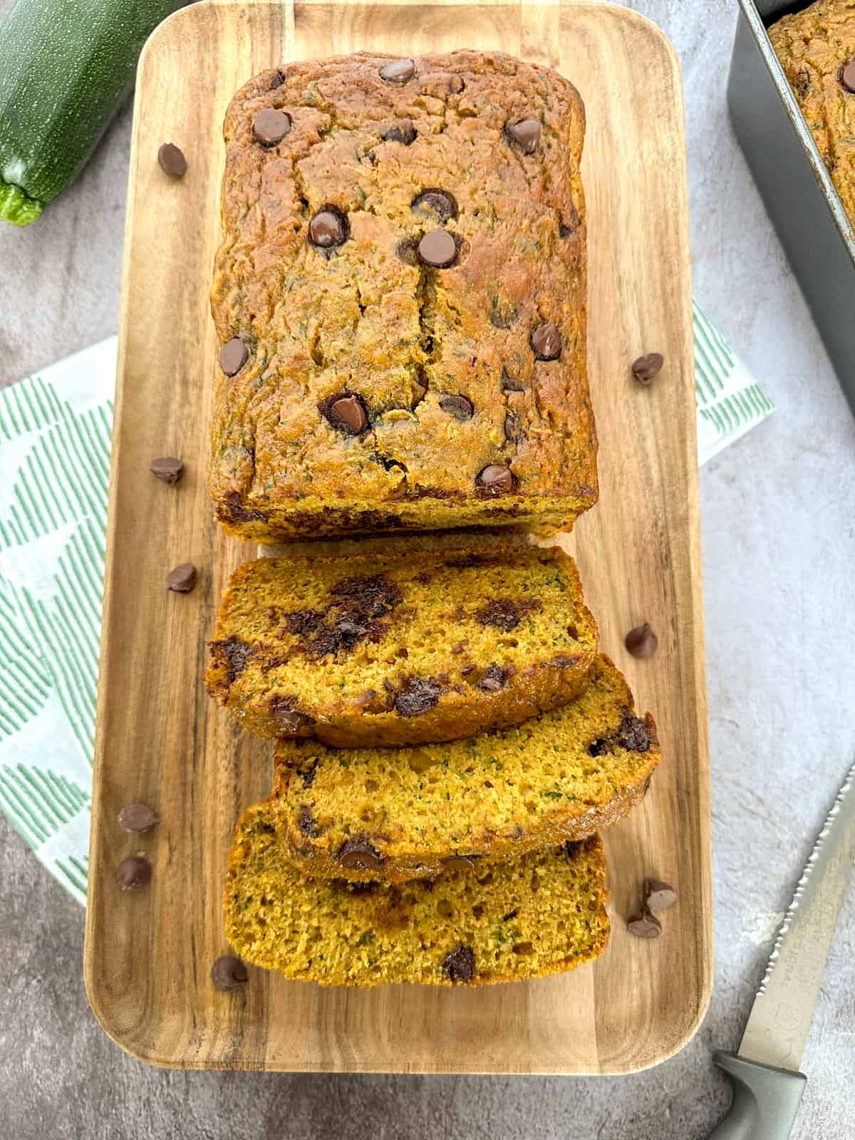 Pumpkin Zucchini Bread with Chocolate Chips sliced on a board
