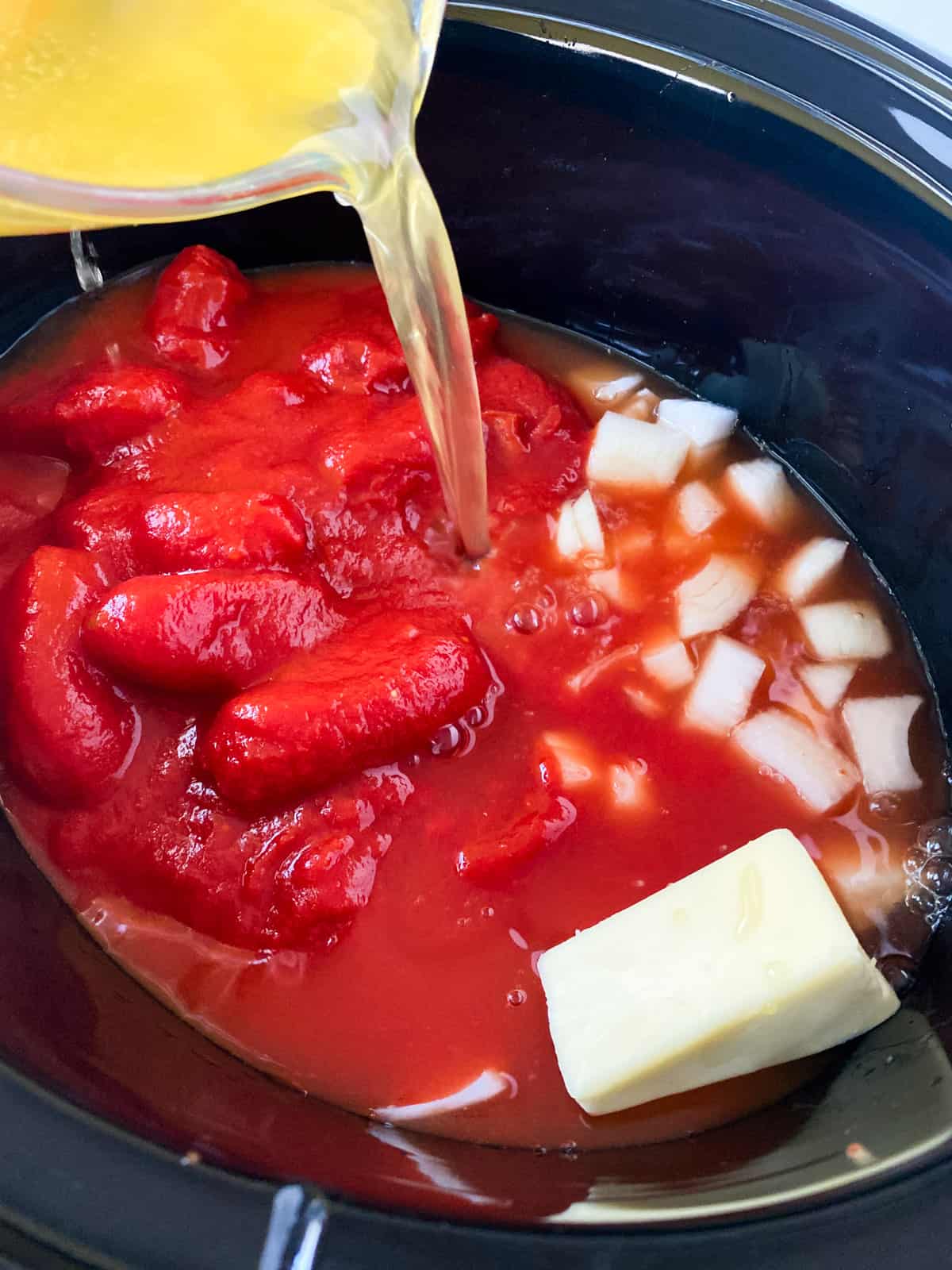 adding all the ingredients into the crock pot