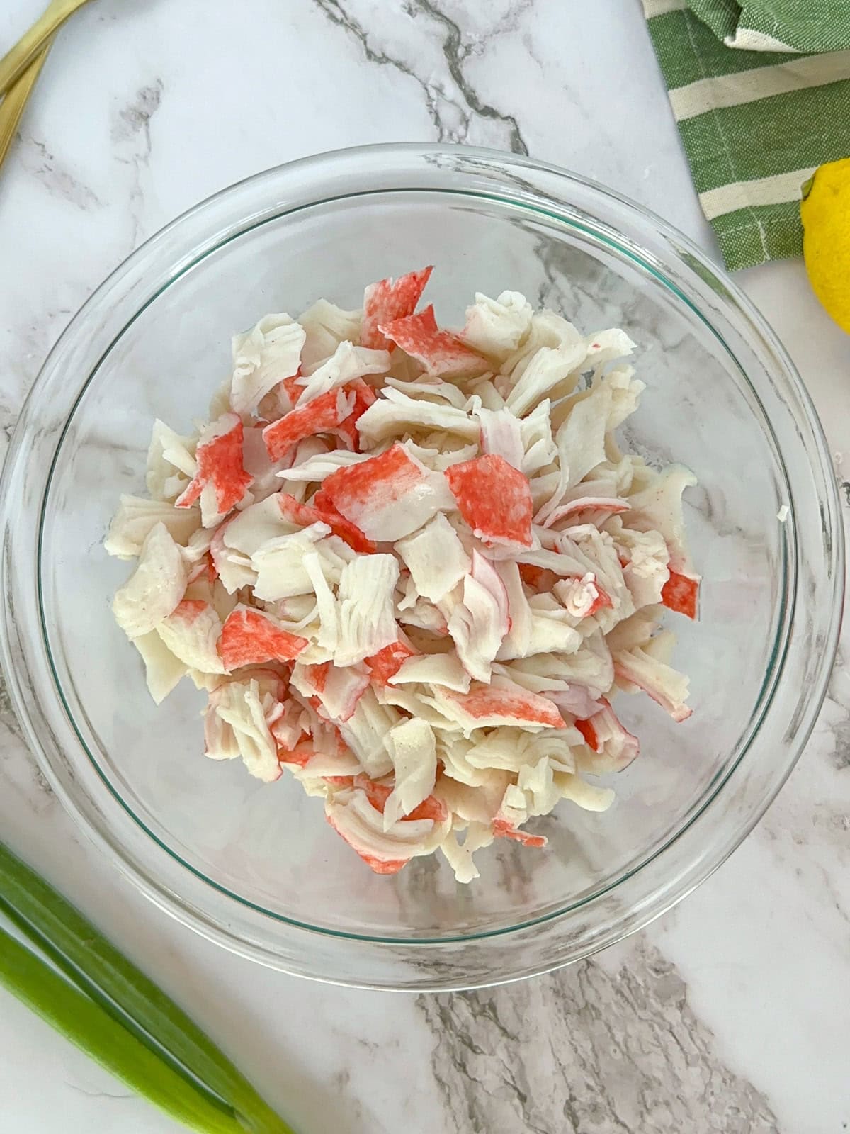 A bowl of shredded imitation crab meat.